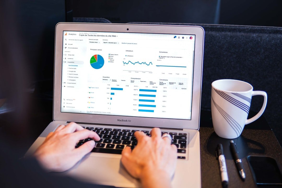 What UI and UX Mean for Your Website 1 Person using macbook pro on black table