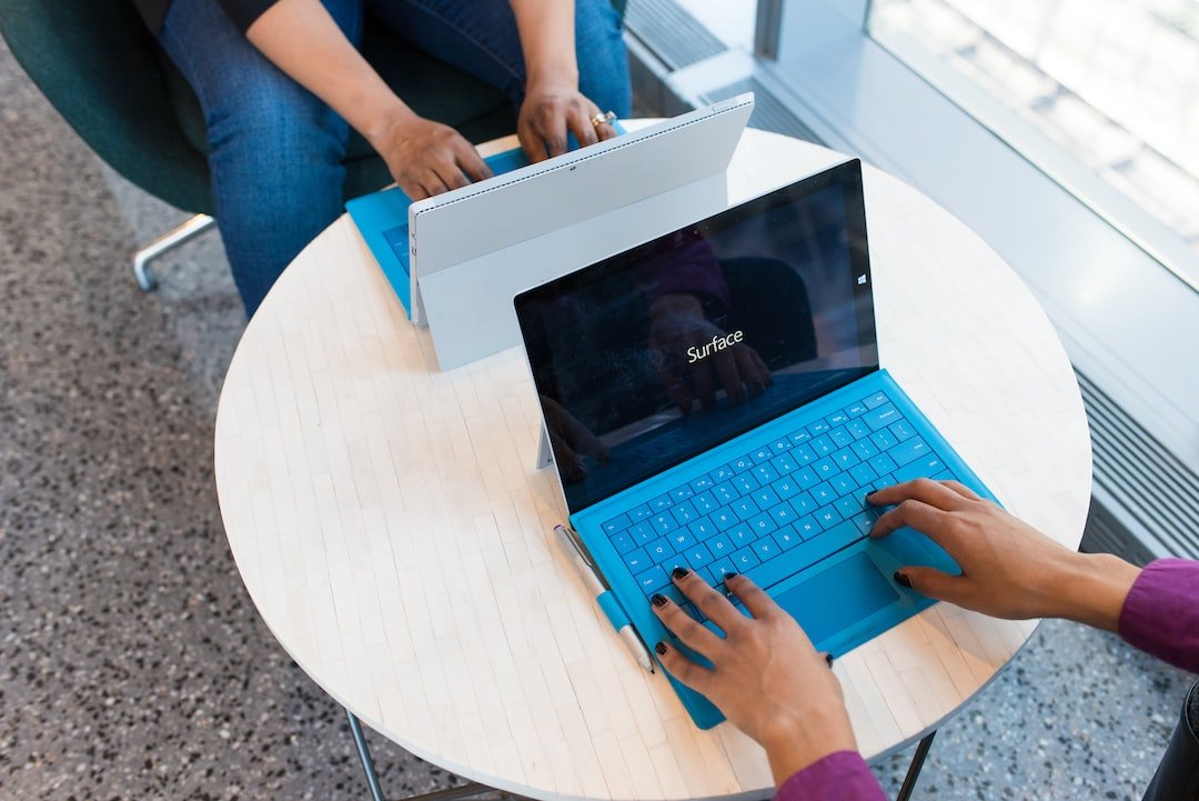 two person using Microsoft Surface